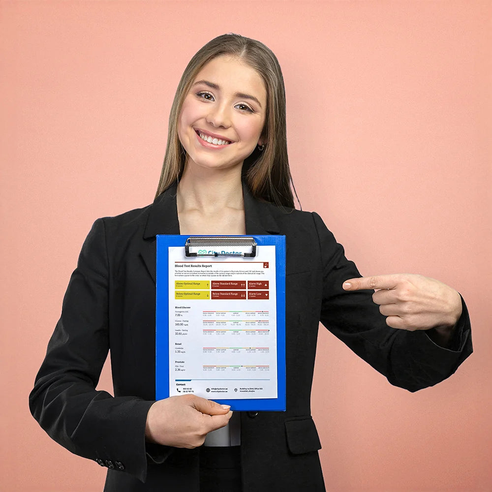 A smiling woman holding her lab report